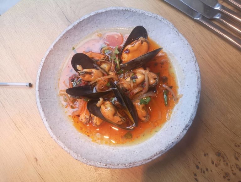 Plump mussels steamed in xaosing wine, in a smoky and fiery broth with chilli oil and kohlrabi kimchi