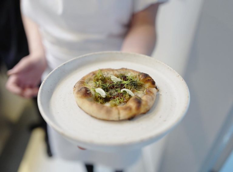 tiny ‘pizza’ baked with lardo and topped with pickled bronze fennel, spruce shoots, rowan shoots and rose oil